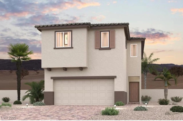 8544 W Agate Ave, Las Vegas, NV 89113 - mediterranean / spanish-style house with stucco siding, a garage, and decorative driveway