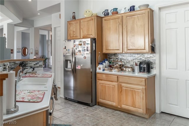 1239 N Hollywood Blvd, Las Vegas, NV 89110 - kitchen with stainless steel fridge with ice dispenser, backsplash, light countertops, recessed lighting, and light tile patterned flooring