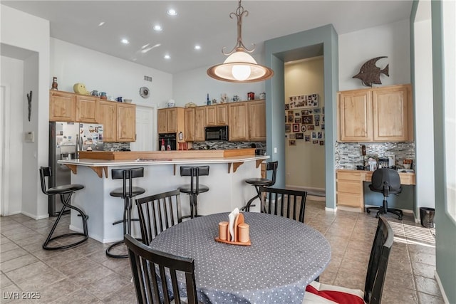 1239 N Hollywood Blvd, Las Vegas, NV 89110 - dining space featuring recessed lighting, light tile patterned floors, a towering ceiling, and built in desk