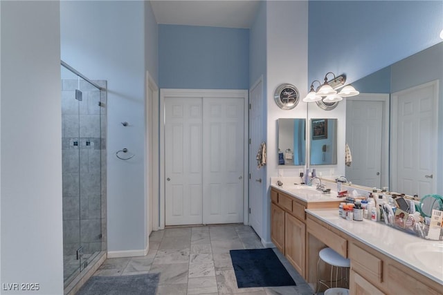 1239 N Hollywood Blvd, Las Vegas, NV 89110 - full bathroom featuring a shower stall, double vanity, and marble finish flooring