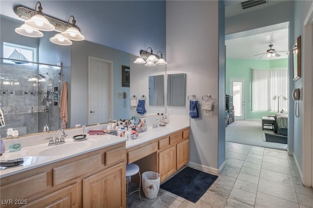 1239 N Hollywood Blvd, Las Vegas, NV 89110 - full bathroom with double vanity, a stall shower, healthy amount of natural light, and ceiling fan