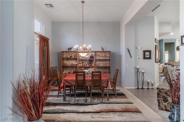 1239 N Hollywood Blvd, Las Vegas, NV 89110 - dining room featuring a chandelier and baseboards