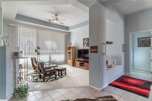 1239 N Hollywood Blvd, Las Vegas, NV 89110 - tiled living room featuring ceiling fan and a raised ceiling