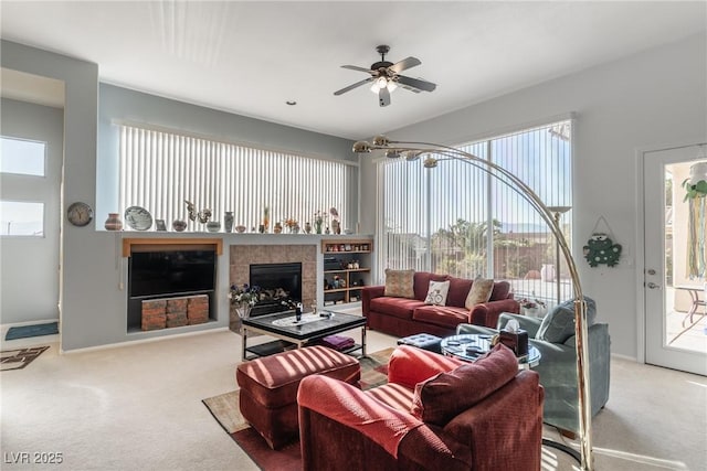 1239 N Hollywood Blvd, Las Vegas, NV 89110 - carpeted living room featuring a ceiling fan and a fireplace