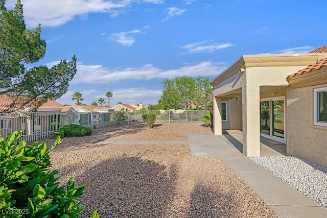 8924 Signal Terrace Dr, Las Vegas, NV 89134 - fenced yard with a patio and a residential view