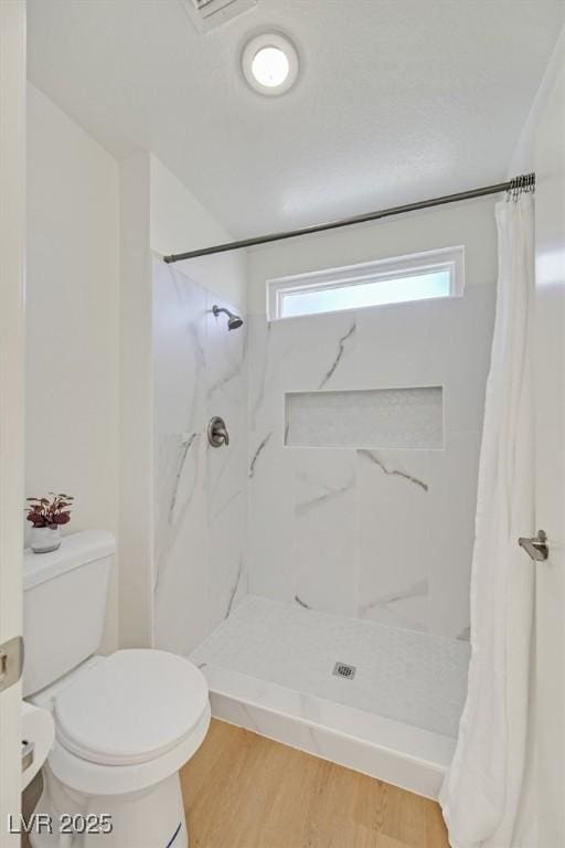 8924 Signal Terrace Dr, Las Vegas, NV 89134 - bathroom with a shower stall and wood finished floors