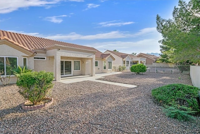 8924 Signal Terrace Dr, Las Vegas, NV 89134 - back of house with a tiled roof, stucco siding, a patio, and a residential view