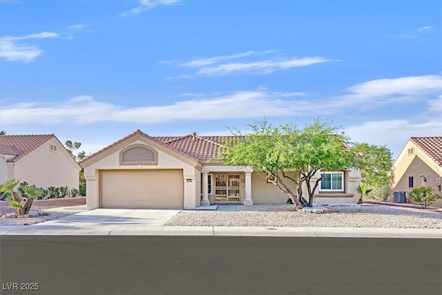 8924 Signal Terrace Dr, Las Vegas, NV 89134 - view of front of property with stucco siding, an attached garage, concrete driveway, and a tile roof