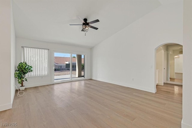 8924 Signal Terrace Dr, Las Vegas, NV 89134 - spare room featuring ceiling fan, arched walkways, light wood-style floors, and high vaulted ceiling