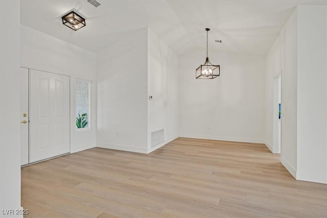 8924 Signal Terrace Dr, Las Vegas, NV 89134 - foyer featuring a chandelier, light wood-style floors, and lofted ceiling
