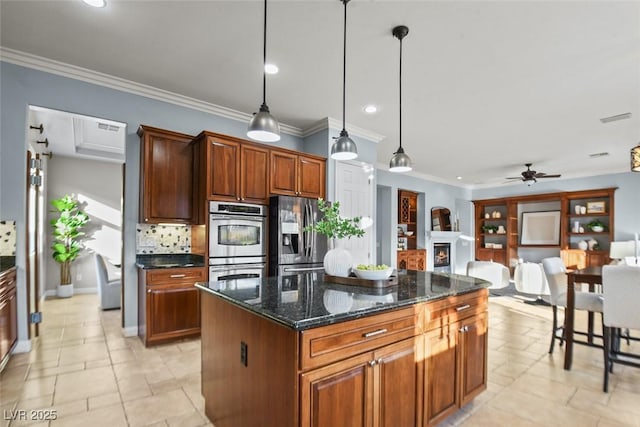 8209 Chapelle Ct, Las Vegas, NV 89131 - kitchen featuring stainless steel appliances, ornamental molding, a warm lit fireplace, a ceiling fan, and hanging light fixtures