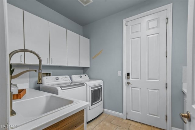 8209 Chapelle Ct, Las Vegas, NV 89131 - laundry room with cabinet space, independent washer and dryer, and light tile patterned floors