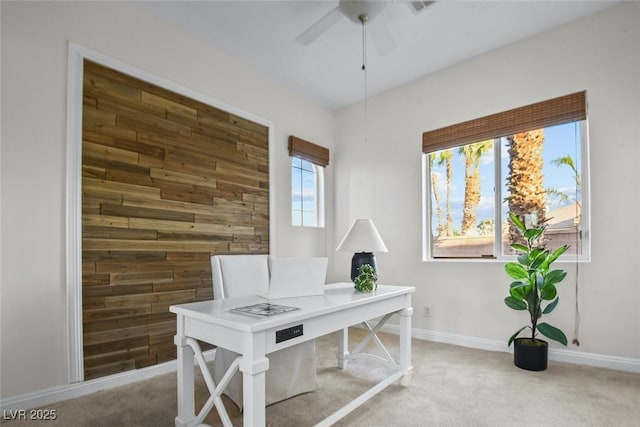 8209 Chapelle Ct, Las Vegas, NV 89131 - carpeted home office with wood walls and a ceiling fan