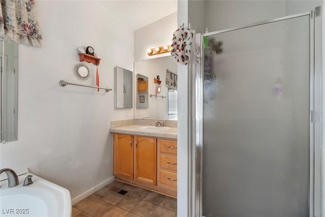 6337 W Cactus Ave, Las Vegas, NV 89141 - bathroom featuring a shower stall and vanity