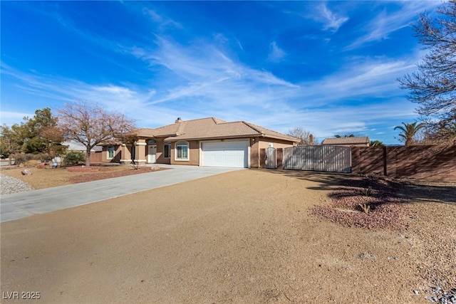 6781 Southgate St, Pahrump, NV 89061 - ranch-style home with a garage, driveway, stucco siding, and a gate