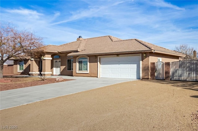 6781 Southgate St, Pahrump, NV 89061 - view of front of property featuring concrete driveway, a tiled roof, an attached garage, a chimney, and stucco siding