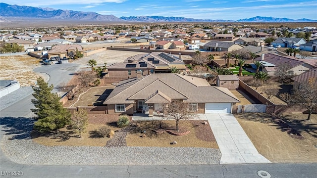 6781 Southgate St, Pahrump, NV 89061 - aerial perspective of suburban area with a mountain backdrop