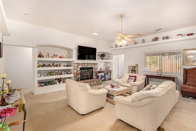 6781 Southgate St, Pahrump, NV 89061 - living area featuring light carpet, ceiling fan, and a fireplace