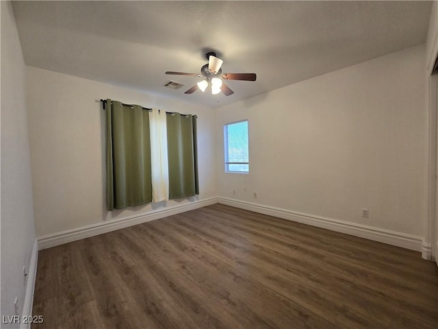 6638 Babys Tear Pl, Las Vegas, NV 89148 - spare room with dark wood-type flooring and a ceiling fan