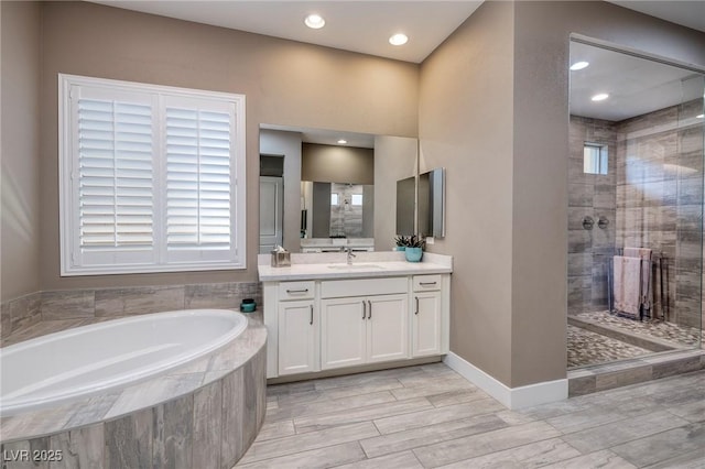 10349 Bressana Dr, Las Vegas, NV 89135 - bathroom featuring a garden tub, vanity, a tile shower, recessed lighting, and wood tiled floors