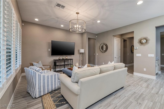 10349 Bressana Dr, Las Vegas, NV 89135 - living room with recessed lighting, a chandelier, and light wood-style flooring