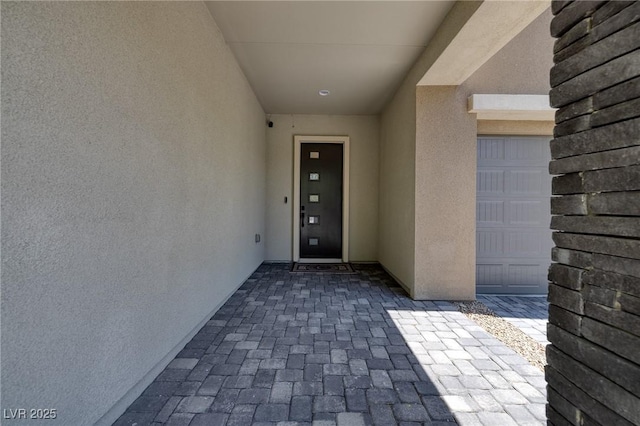 10349 Bressana Dr, Las Vegas, NV 89135 - property entrance with stucco siding and a garage