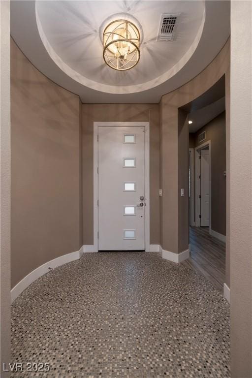 10349 Bressana Dr, Las Vegas, NV 89135 - foyer featuring a tray ceiling and a chandelier