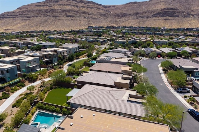 10349 Bressana Dr, Las Vegas, NV 89135 - aerial perspective of suburban area featuring a mountainous background and a pool