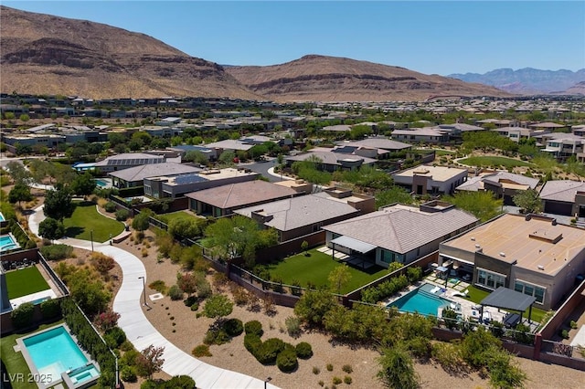 10349 Bressana Dr, Las Vegas, NV 89135 - aerial view of residential area featuring a pool area and a mountain backdrop