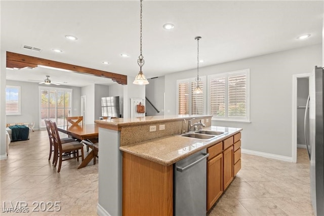 11274 Civita St, Las Vegas, NV 89141 - kitchen with appliances with stainless steel finishes, recessed lighting, open floor plan, brown cabinetry, and a kitchen island with sink
