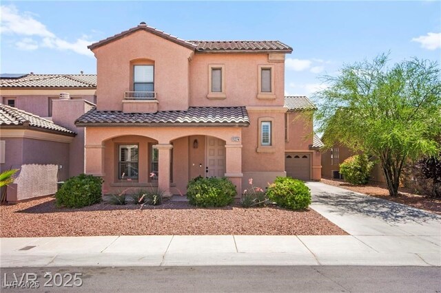 11274 Civita St, Las Vegas, NV 89141 - mediterranean / spanish-style house featuring a tile roof, a porch, stucco siding, concrete driveway, and an attached garage