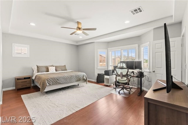 11274 Civita St, Las Vegas, NV 89141 - bedroom featuring wood finished floors, a raised ceiling, recessed lighting, and a ceiling fan