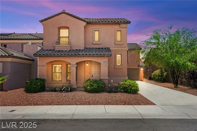 11274 Civita St, Las Vegas, NV 89141 - view of front of house with a tile roof, concrete driveway, covered porch, and stucco siding
