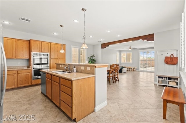 11274 Civita St, Las Vegas, NV 89141 - kitchen with stainless steel appliances, recessed lighting, a ceiling fan, light countertops, and an island with sink