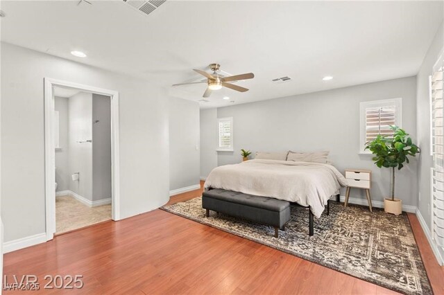 11274 Civita St, Las Vegas, NV 89141 - bedroom with wood finished floors, recessed lighting, ceiling fan, and connected bathroom
