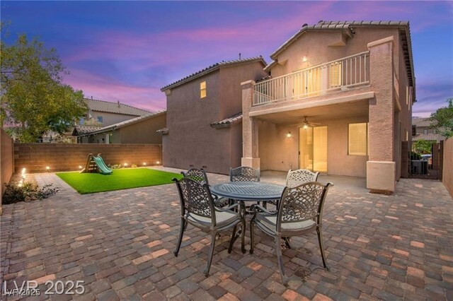 11274 Civita St, Las Vegas, NV 89141 - patio / terrace featuring a patio area, a fenced backyard, outdoor dining area, and a playground