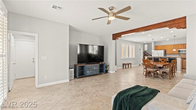 11274 Civita St, Las Vegas, NV 89141 - living area with a ceiling fan, recessed lighting, light tile patterned flooring, stairs, and beamed ceiling