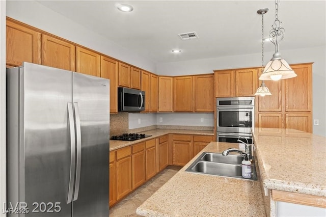 11274 Civita St, Las Vegas, NV 89141 - kitchen featuring appliances with stainless steel finishes, pendant lighting, recessed lighting, and an island with sink
