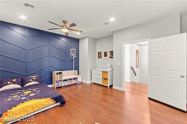 11274 Civita St, Las Vegas, NV 89141 - bedroom with wood finished floors, recessed lighting, a ceiling fan, and a decorative wall