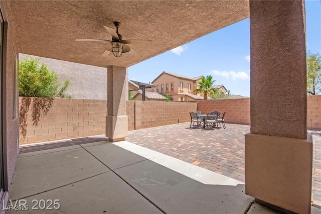 11274 Civita St, Las Vegas, NV 89141 - fenced backyard featuring outdoor dining space, a patio area, and ceiling fan
