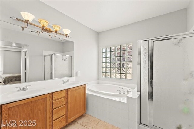 11274 Civita St, Las Vegas, NV 89141 - ensuite bathroom featuring tile patterned flooring, a shower stall, a bath, and double vanity