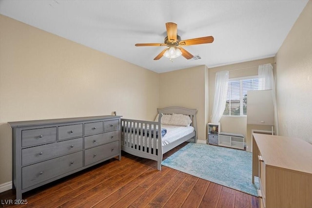 7028 Weavers Pl, North Las Vegas, NV 89084 - bedroom with dark wood-style flooring and a ceiling fan