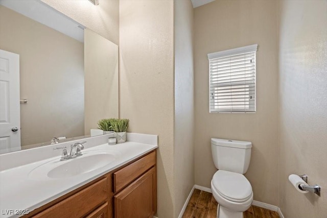 7028 Weavers Pl, North Las Vegas, NV 89084 - half bathroom with wood finished floors and vanity