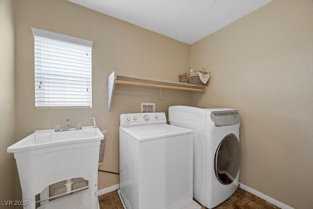 7028 Weavers Pl, North Las Vegas, NV 89084 - washroom featuring washer and dryer and baseboards