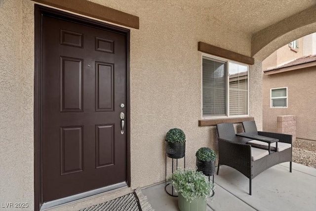 7028 Weavers Pl, North Las Vegas, NV 89084 - property entrance with stucco siding