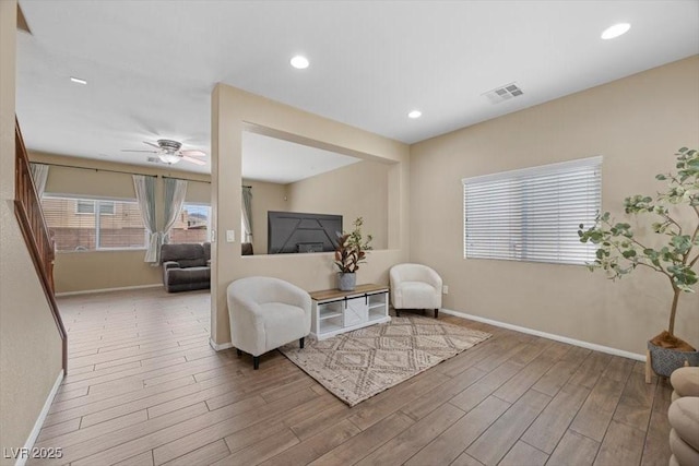 7028 Weavers Pl, North Las Vegas, NV 89084 - living area with wood finished floors, ceiling fan, and recessed lighting