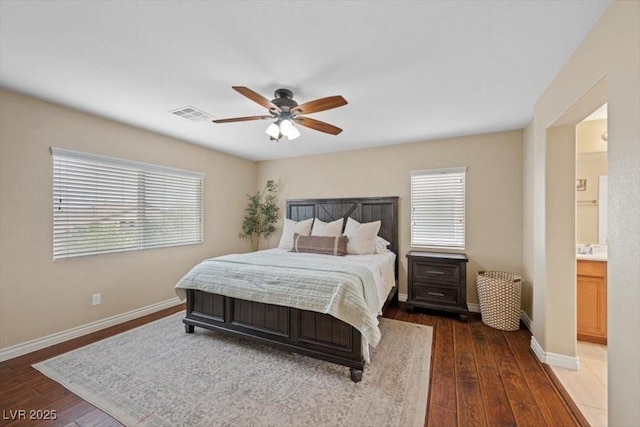 7028 Weavers Pl, North Las Vegas, NV 89084 - bedroom with multiple windows, hardwood / wood-style floors, and a ceiling fan
