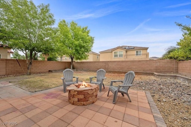 7028 Weavers Pl, North Las Vegas, NV 89084 - fenced backyard featuring an outdoor fire pit and a patio