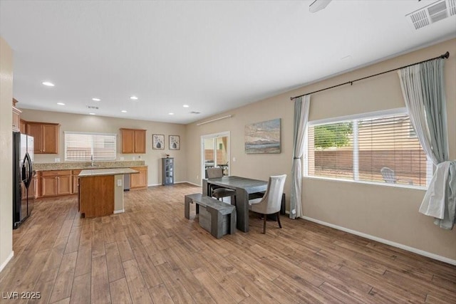 7028 Weavers Pl, North Las Vegas, NV 89084 - dining room with light wood finished floors and recessed lighting