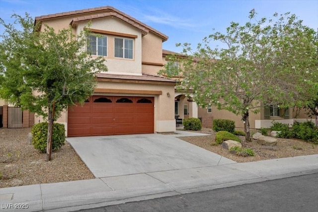 7028 Weavers Pl, North Las Vegas, NV 89084 - traditional-style house with a garage, driveway, and stucco siding